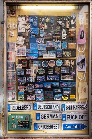 Signs and knick-knacks for tourists in a shop window of a shop in the old town of Heidelberg. The shop is closed due to the Corona pandemic