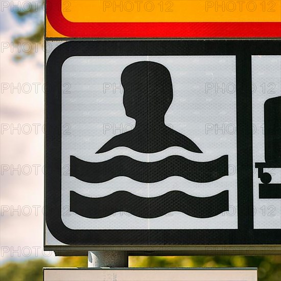 Sign Bathing Place by the Sea with Pictogram Swimmer