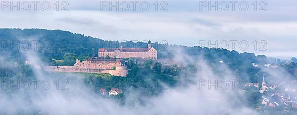 View of Plassenburg Castle and Kulmbach in the morning mist