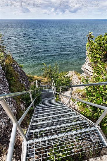 View from above of metal stairs and cliff Hoegklint in summer