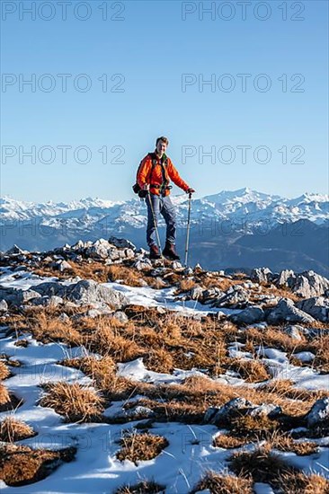 Mountaineer in front of mountain panorama