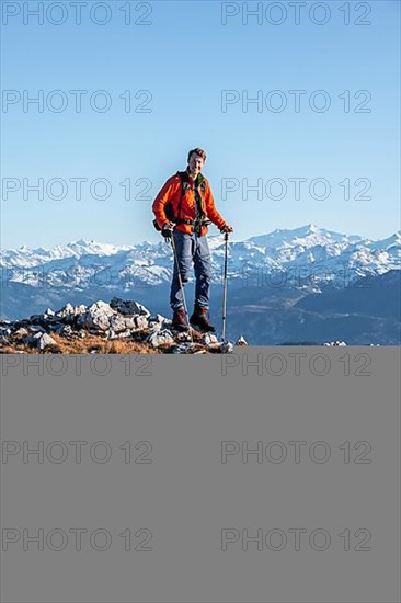 Mountaineer in front of mountain panorama