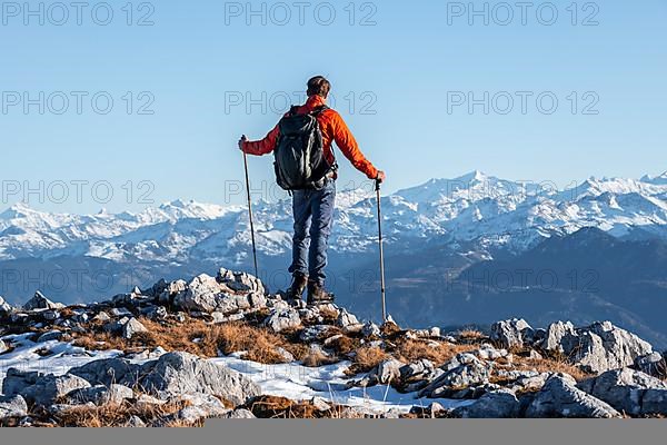 Mountaineer in front of mountain panorama