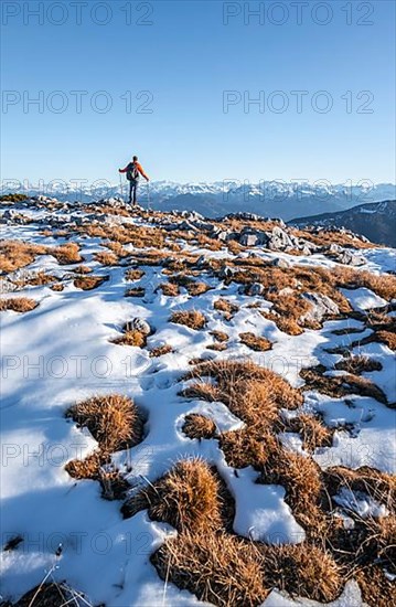 Mountaineer in front of mountain panorama