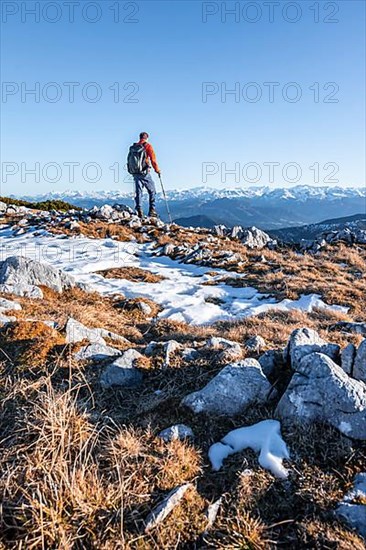 Mountaineer in front of mountain panorama