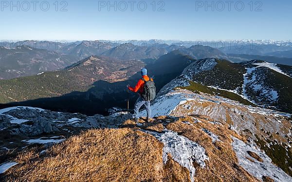 Climbers on the summit ridge with first snow in autumn