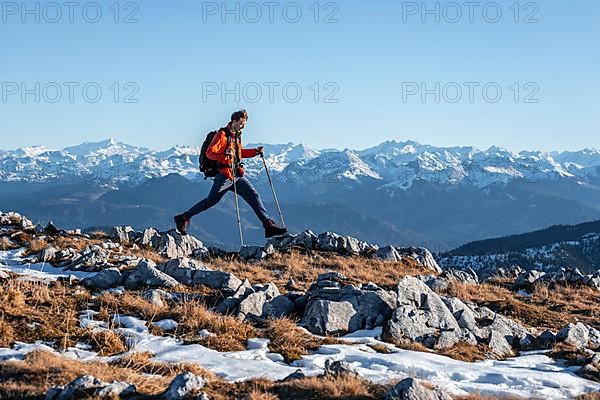 Mountaineer taking a big step