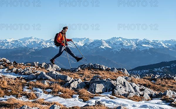 Mountaineer taking a big step