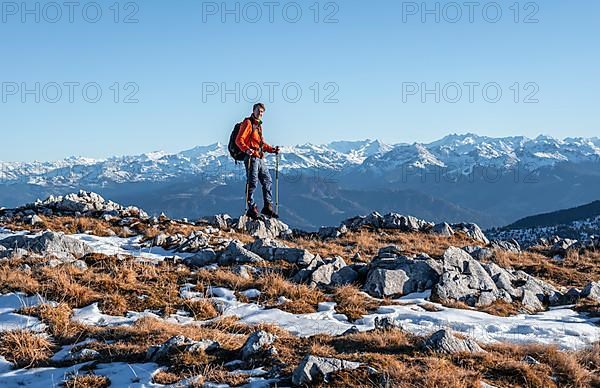 Mountaineer in front of mountain panorama