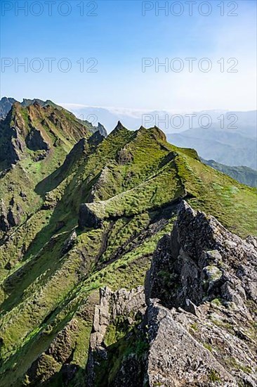 Pointed green mountain peaks on the ridge of Tindfjoell