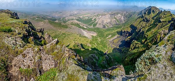 Pointed green mountain peaks on the ridge of Tindfjoell