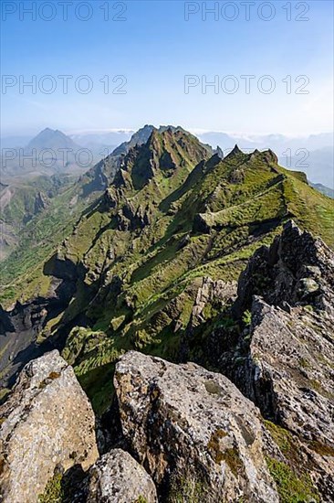 Pointed green mountain peaks on the ridge of Tindfjoell