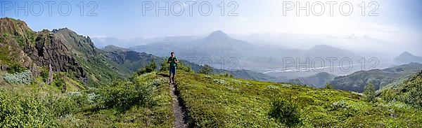 Hikers on trail at the ridge of Tindfjoell