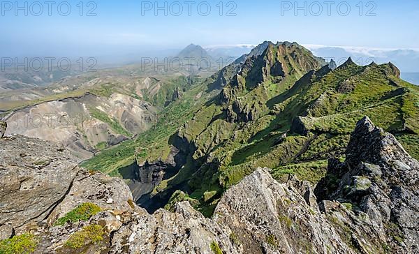 Pointed green mountain peaks on the ridge of Tindfjoell