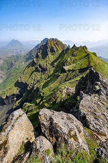 Pointed green mountain peaks on the ridge of Tindfjoell