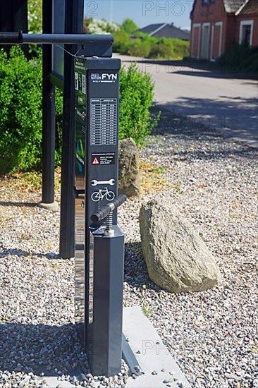 Bike station with tools and bike pump at a repair station along the Manor Route
