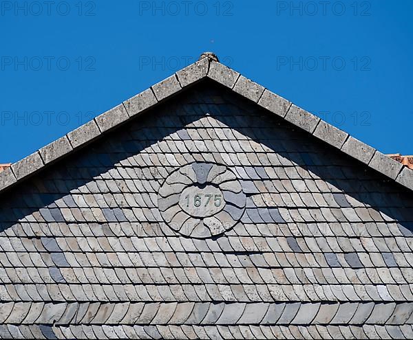 Facade covered with slate shingles of a former restaurant at the Auerhahnteich