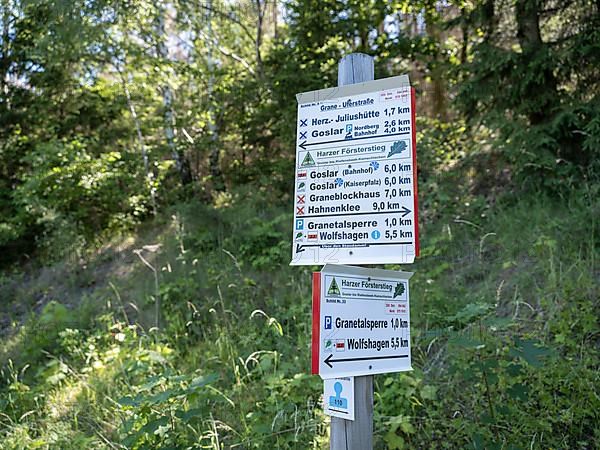 Hiking signpost on the bank of the Granetalsperre