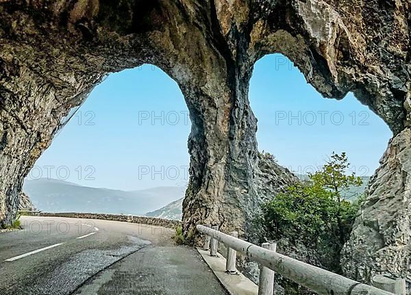 Rock arch on road near Greolieres