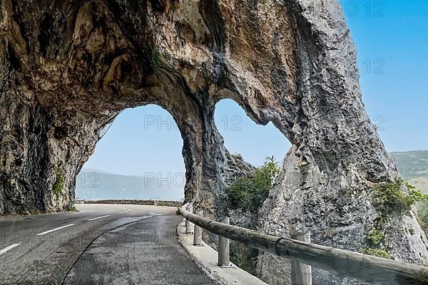 Rock arch on road near Greolieres