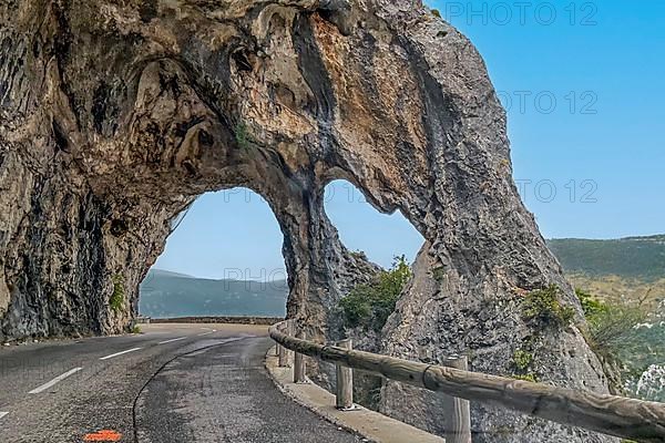 Rock arch on road near Greolieres