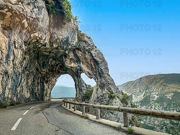 Rock arch on road near Greolieres