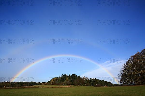 Rainbow over field and woodland near Eschweiler