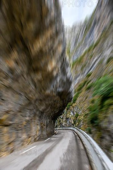 View at high speed through windscreen of car during rally in curve of gorge Clue de St-Auban