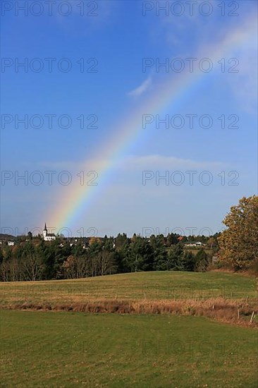 Rainbow over field and woodland near Eschweiler