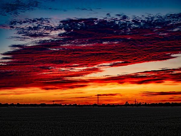 Sunset with red coloured clouds on the evening of the solstice