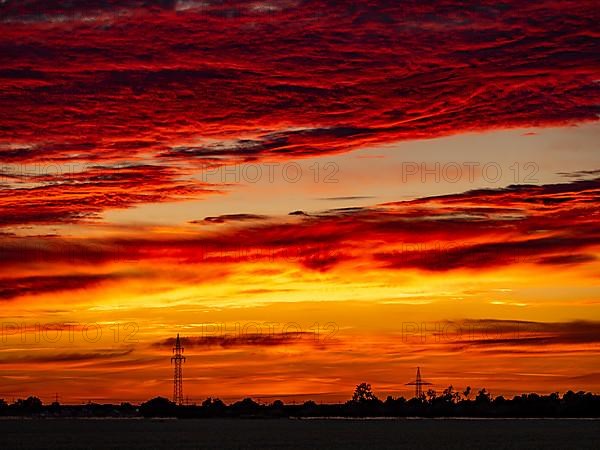 Sunset with red coloured clouds on the evening of the solstice