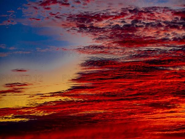 Sunset with red coloured clouds on the evening of the solstice