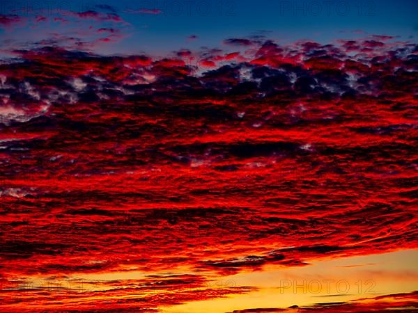 Sunset with red coloured clouds on the evening of the solstice