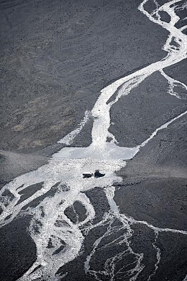 Car crossing river at a ford