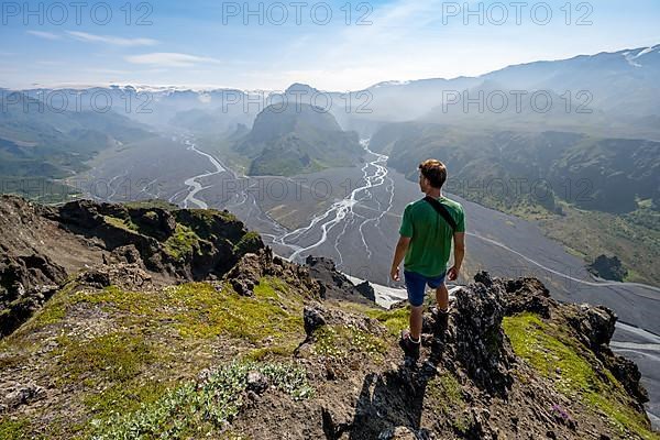 Hikers in front of mountain landscape