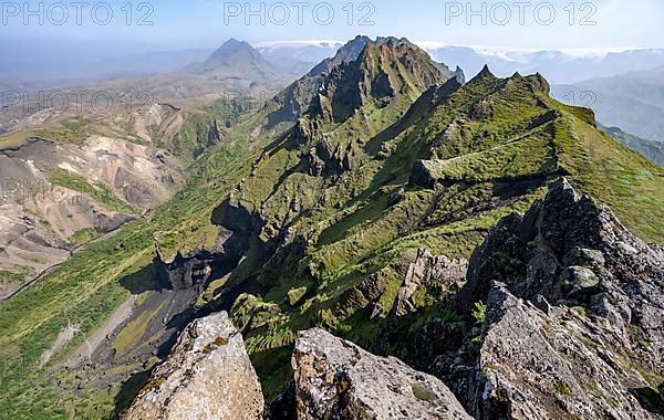 Pointed green mountain peaks on the ridge of Tindfjoell