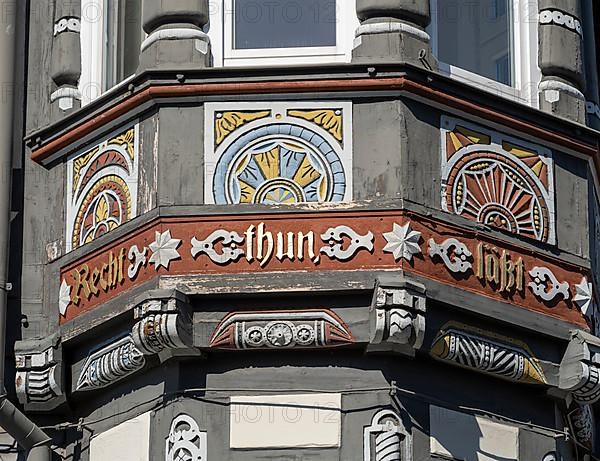 Half-timbered house decorated with carvings in the old town