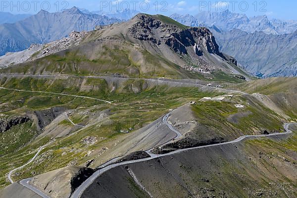 View from Cime de la Bonette on high alpine mountain landscape with alpine pass Col de la Bonette in the middle in front