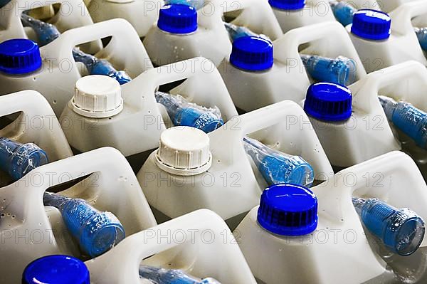 White plastic canisters in DIY store