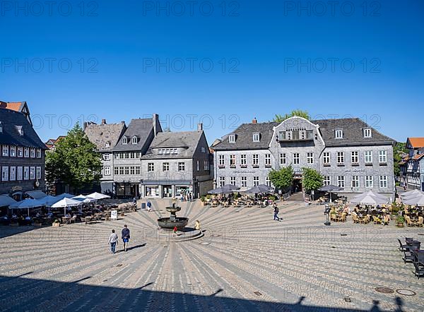 Market square with market fountain and Kaiserringhaus with slate facade