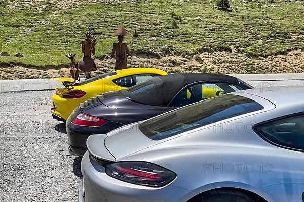 Rear of three sports cars