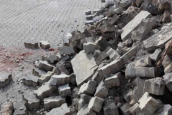 Demolition of an old paved area of an industrial wasteland