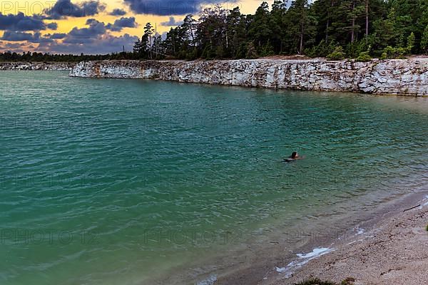 Person swimming in bathing lake Blue Lagoon