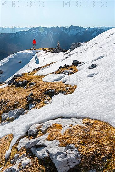 Mountaineer next to a cairn