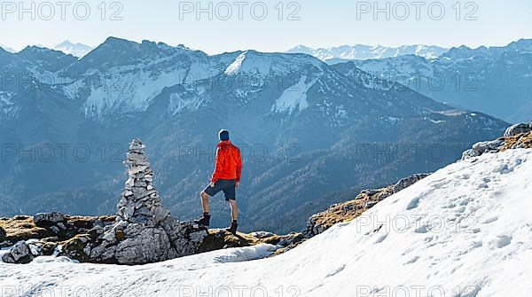 Mountaineer next to a cairn