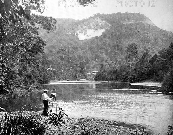 Painter standing on the banks of the Saco River