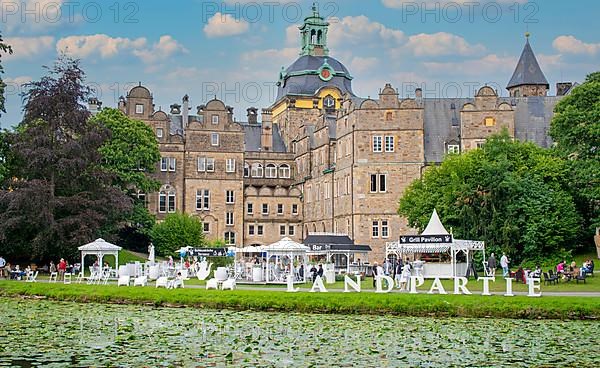 Food and drink stands in front of the castle