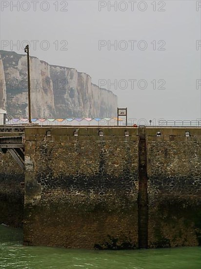 Coastal village of Le Treport at the mouth of the Bresle on the English Channel with the highest chalk cliff in Europe