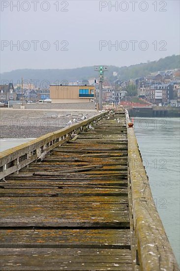 Old wooden jetty in the harbour of the coastal village of Le Treport at the mouth of the Bresle on the English Channel