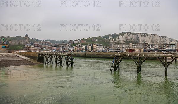 Coastal village of Le Treport at the mouth of the Bresle on the English Channel with Europe's highest chalk cliff and Saint-Jacques church